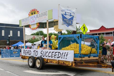 The Volunteers for Literacy float makes its way through the Mtn Laurel Festival parade with many ducks for the VFL Duck Race. ZACH TAYLOR/Staff