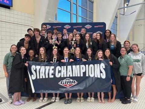 The TFS swim team poses after winning the state title in their first year as a member of GIAA. SUBMITTED