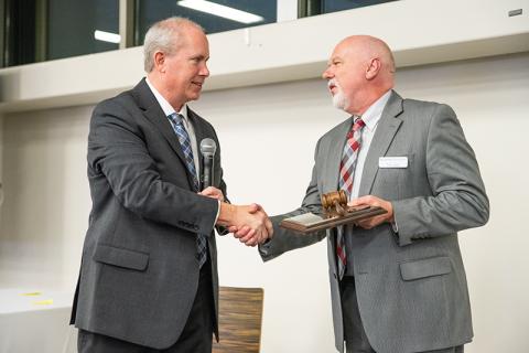 Past Chairman Tim Ash, right, passes the gavel to now-current Chairman Tommy Thurmond. ZACH TAYLOR/Staff