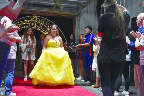 Tiffany Flack stands out on the red carpet in her yellow Belle gown. SAMANTHA SINCLAIR/Staff