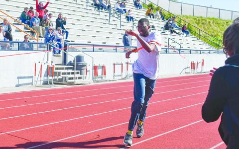 Jeremiah King crosses the finish line to win last year’s 200 meter dash during the Habersham Special Olympics. FILE