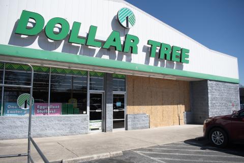 The right side of the Dollar Tree storefront in Clarkesville is boarded with plywood after Friday’s crash, when a motorist accidentally drove into the building. HANNAH CAUDELL/Staff
