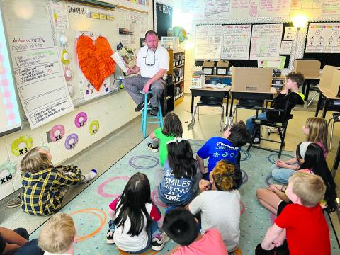 Assistant Superintendent Patrick Franklin reads to Emilee Waldon’s third grade class. SUBMITTED