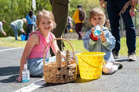 Scotlynn Taylor and Rynlee Leviner enjoy Tummy Yummies and sort their candy after the Mt. Carmel Baptist Church Easter Egg Hunt. The church held several different egg hunts for different age groups, including a tinsel-filled kid's pool for babies to hunt Easter eggs in. ZACH TAYLOR/Staff
