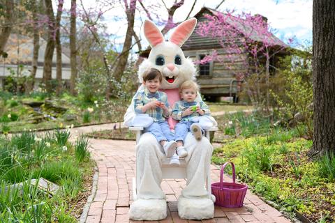 Owen and Isaac Crawford smile for a photo with the Easter Bunny behind the Mauldin House in Clarkesville. FILE