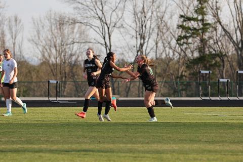 TIN POFFENBERGER/Special Lady Indians’ players (from left) Ryleigh Wilson, Lizzie Huebner and Miah Gragg celebrate a TFS goal earlier this spring.