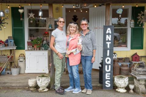 Sarah, Connie and Lori Walters stand in front of the cozy building just south of the barn. ZACH TAYLOR/Staff
