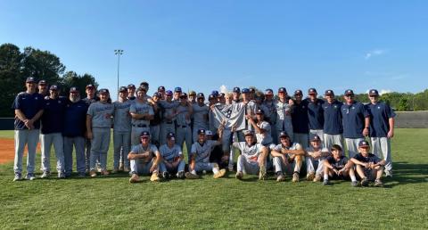 The Diamond Raiders pose around Gage Teague’s No. 8 jersey following the team’s win to advance to the GHSA Elite 8 Wednesday at South Paulding. SUBMITTED