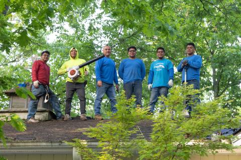 Steevan Carreto, Chavalo Carreto, Badilio Nox, Ronald Carreto, Elias Carreto and Victor Gonzalez of Patriot Roofing pose for a photo on the roof of Jim Morgan's house during the project. ZACH TAYLOR/Staff