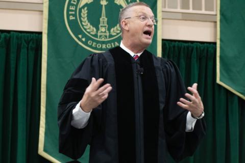 U.S. Secretary of Veteran Affairs Doug Collins addresses the Piedmont’s Class of 2025 with a simple message: be curious, because life may take you down a road that’s unexpected. HANNAH CAUDELL/Staff