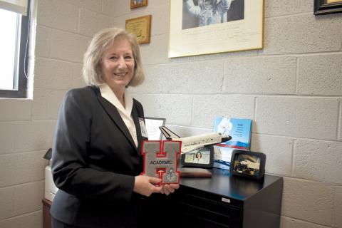 Martha Cantrell is surrounded by memories of her career at both Tallulah Falls School and Habersham County Schools in her office. ‘This has touched hundreds of kids, and I hope in a positive way,’ she said, holding an academic letter. Samantha Sinclair/Staff