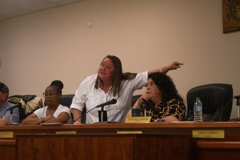 Baldwin Councilwoman Alice Venter, left, stands to her feet next to Mayor Stephanie Almagno to explain what the public works department does for the city to justify their take-home vehicles, as well as other utility vehicles that are paid for with SPLOST dollars and maintained through public dollars. HANNAH CAUDELL/Staff