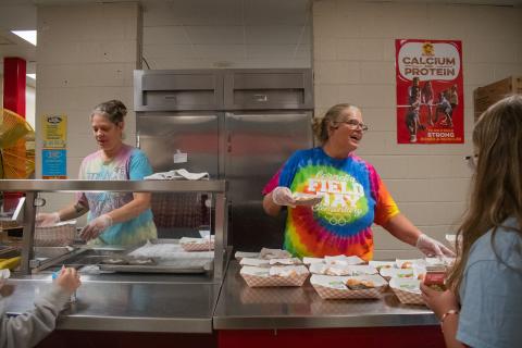 Ann Lewallen (right) works in the Cornelia Elementary School kitchen service line to serve the children coming through for breakfast on Thursday morning. HANNAH CAUDELL/Staff