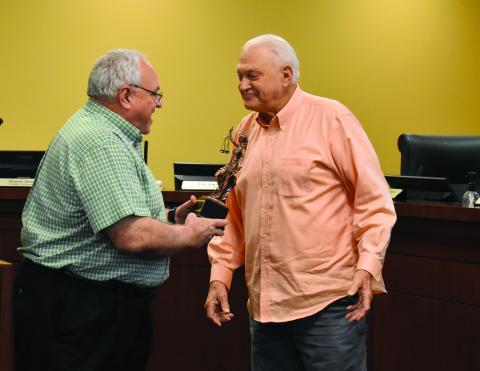 Commission Chairman Jimmy Tench, right,  hands Donnie Hunt a statue from the Habersham County Board of Commissioners as a token of their appreciation for his years of service to the county.  Samantha Sinclair/Staff