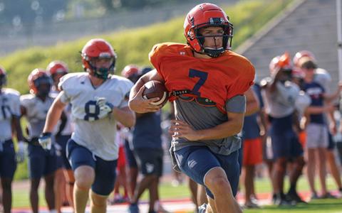 Habersham Central quarterback Paris Wilbanks runs with the ball during the first day of the padded camp on Tuesday, June 24 at Raider Stadium. (LANDEN TODD/Staff)