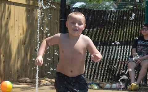 Nathan Dickerson plays at the Cornelia Splash Pad on a hot Tuesday morning. Taking the kids to the pool or the splash pad may be one way to beat the extreme heat this week in Habersham County. (HANNAH CAUDELL/Staff)
