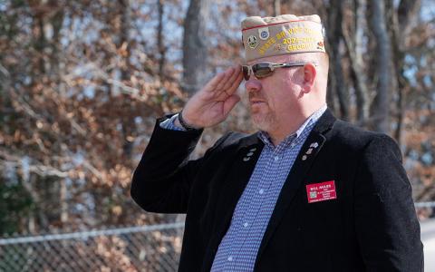 Bill Miles, state commander of the Veterans of Foreign Wars Georgia Department, salutes a fellow soldier during last year’s Wreaths Across America ceremony at the VFW Post 7720 Cemetery. (Zach Taylor/Staff)