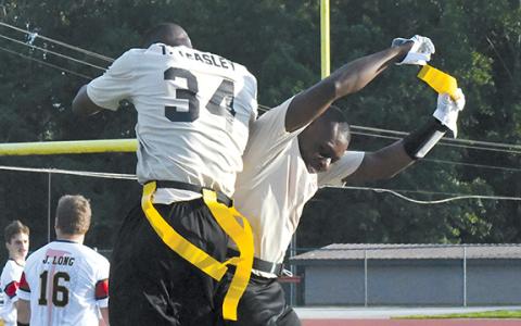 Tedarrius Teasley and Tomorea McGlockling of the Habersham-Banks team celebrate an interception during last year’s Battle of the Heroes game. (File)