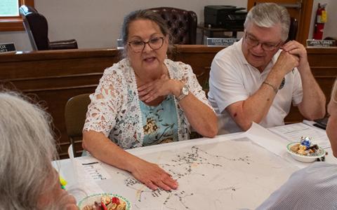Mayor Gail Armour shows the council a map of the town’s water lines and where the town can possibly expand with the approval of SPLOST VIII funding. (Hannah Caudell/Staff)