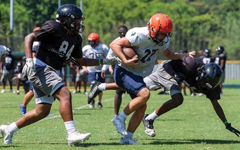 Habersham Central’s Hudson Barnett sheds off a defender during the FCA Team Camp at Piedmont University on Tuesday, July 15. (Landen Todd/Staff)