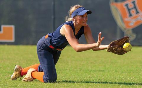 Habersham Central’s Kaylan Barrett makes a diving catch during softball practice at Raider Field on Monday, July 7. (Landen Todd/Staff)