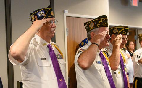 Honor Guard members Ed Hendricks, Rick Chaffin and Gary Cantwell salute as Danny Stephens plays the bugle. (Zach Taylor/Staff)