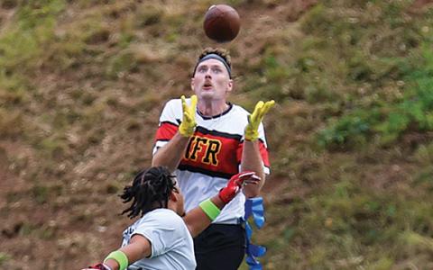 First responder Kyle Weatherly receives the ball for a touchdown during the Battle of the Heroes on Saturday, Aug. 2 at Raider Stadium. Hall County won 44-6. (Landen Todd/Staff)