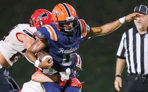 Habersham Central senior running back Donnie Warren (0) breaks through defenders during the game between Flowery Branch and Habersham Central at Raider Stadium on Friday, Aug. 22. The Raiders lost 31-28. (Landen Todd/Staff)