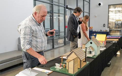 Mike Watts checks out handmade birdhouses that were part of the silent auction for SRWA. (Zach Taylor/Staff)