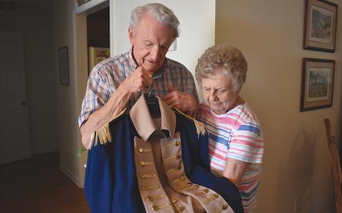 Larry and Evie Whitfield are proud of their Revolutionary War ancestors, and Larry is one of the men known to dress up in a Revolutionary War uniform for events and while serving as a member of the Georgia Sons of the American Revolution Color Guard. His uniform was specially-made by a seamstress in Texas, and he’s taken good care of it over the years. (Samantha Sinclair/Staff)