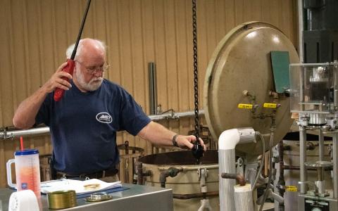 David Barnes helps with the canning process at the Habersham County Canning Plant. Barnes has been working at the canning plant since 1983. (Hannah Caudell/Staff)