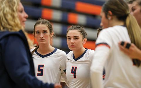 The Lady Raiders huddle up during a match between Jackson County and Habersham Central at Raider Gymnasium on Tuesday, Sept. 16. (Landen Todd/Staff)