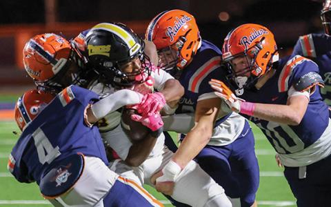 Habersham Central’s defense swarms an Alcovy player during a football game between Alcovy and Habersham Central at Raider Field on Friday, Oct. 10. (Landen Todd/Staff)