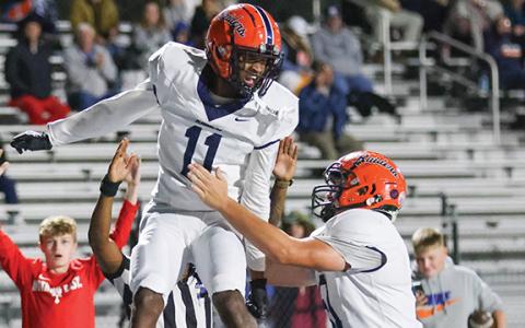 Habersham Central junior wide receiver Jay Feltus (11) celebrates with senior lineman Austin Williams (51) during a football game between Habersham Central and Apalachee at Apalachee Wildcats Football Stadium on Friday, Oct. 24. Feltus caught three touchdown passes in the second quarter.  (Landen Todd/Staff)