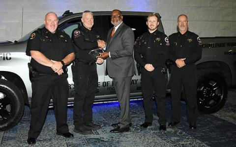 The Habersham County Sheriff’s Office team, including Sheriff Robin Krockum (far left) smile as Allen Poole, the director of the Governor’s Office of Highway Safety (middle), presents them with the sheriff’s office’s third place award in Category Four in the Governor’s Challenge Awards. The sheriff’s office also earned HEAT Team of the Year for the fourth time. (Submitted)