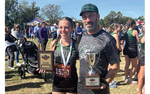Junior All-State honors harrier Olivia Henderson and Head Varsity XC and Track and Field Coach and assistant Athletic Director Jamie Jimison present thier GIAA state awards at the end of the season.  (Submitted)
