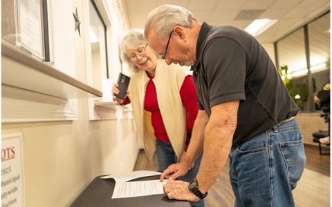 Demorest council candidates Patti Davis and Jim Welborn take a look at precinct results at the Habersham County Elections and Voter Registration Office Tuesday night.  (Zach Taylor/Staff)