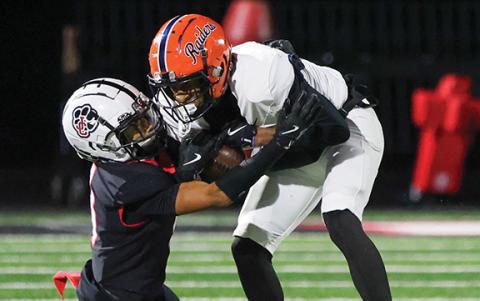 Habersham Central junior wide receiver Jay Feltus (11) tries to shed off Jackson County defender after a catch during a football game between Habersham Central and Jackson County for the region championship at Panther Stadium on Friday, Oct. 31. (Landen Todd/Staff)