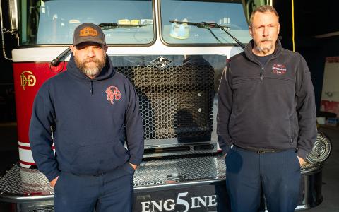 Demorest Fire Capt. Tim Nunnally and Firefighter Justin Upchurch stand in front of Demorest Fire Engine 5 during the final week of the fire department’s service. (Zach Taylor/Staff)
