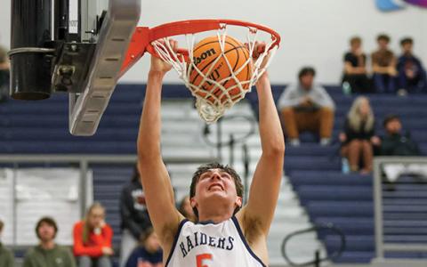 Habersham Central senior forward Jake Mihalick (5) dunks the ball during a basketball game between Rabun Gap-Nacoochee and Habersham Central. (Landen Todd/Staff)