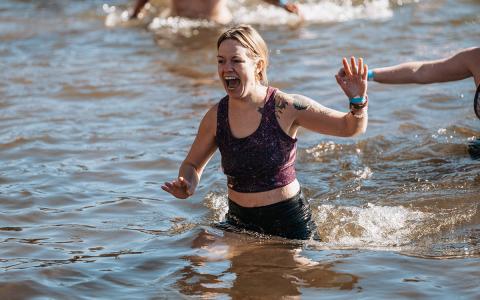 Tiffany Lovell yells out while making her way back to shore. (Zach Taylor/Staff)