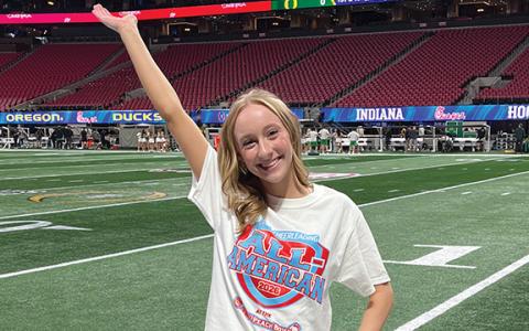 Habersham Central senior Corie Jones poses on the field at the Mercedes-Benz Stadium. The three year All American went through a tryout process to individually perform the All American camp cheer and supreme routine dance in front of a panel of judges. Forty-nine cheerleaders from all across Georgia and surrounding states made the cut. (Submitted)