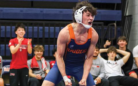 Habersham Central wrestler Christian Saravia celebrates after winning a match against Jackson County during the Region Dual Tournament at the Raider Gymnasium on Saturday Jan. 10. (Landen Todd/Staff)