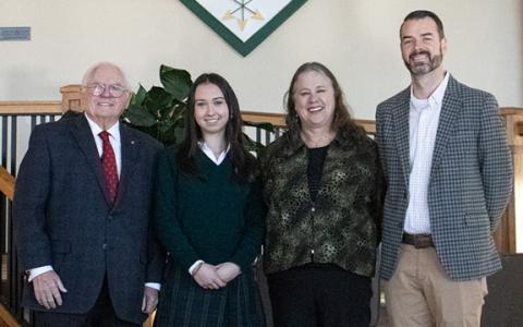 Charlotte Stafford, a TFS senior with an almost impeccable academic track record, has been named this year’s STAR Student for the upper school. Pictured from left are Head of Schools Dr. Larry Peevy, Stafford, STAR Teacher Beth Huebner, and Upper School Academic Dean Jeremy Stille. (Hannah Caudell/Staff)