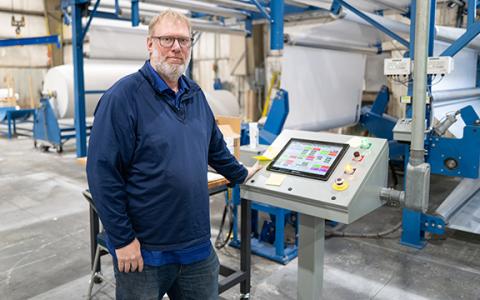 McTech Group Vice President Seth McDonald stands at a console. McTech Group is looking for a permanent home in Habersham County while it temporarily leases a building from Habersham Metal. (Zach Taylor/Staff)