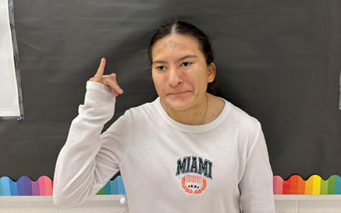 Emily Zaragoza signs the word ‘why.’ The HCHS student has been teaching sign language to local students through weekly ‘A Sign a Day’ videos. (Callie Cueva/Staff)