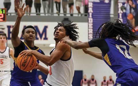 Habersham Central senior guard Donnie Warren (0) drives the ball during a playoff game between Brunswick and Habersham Central at the Raider Gymnasium on Wednesday, Feb. 25. (Landen Todd/Staff)