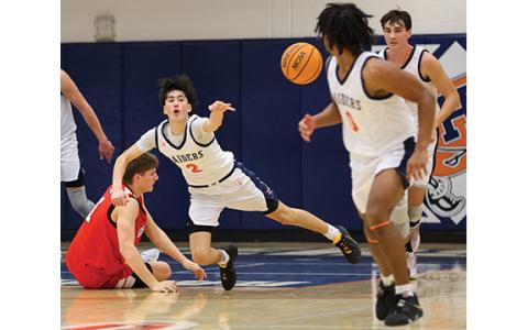 Habersham Central junior guard Eli Maye (2) passes the ball senior guard Donnie Warren (0) during a basketball game between Loganville and Habersham Central at Habersham Central High School on Saturday, Feb. 7. (Landen Todd/Staff)