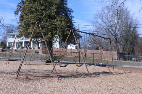 Two old sets of swings sit vacant on the Baldwin  Elementary School playground, waiting for children to fill its seats. The swings could see a potential upgrade with the possible approval of ESPLOST VII by county voters. (Hannah Caudell/Staff)