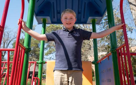 Price Herrin, the inspiration of Price to Play, plays on the current playground in Demorest. (Zach Taylor/Staff)